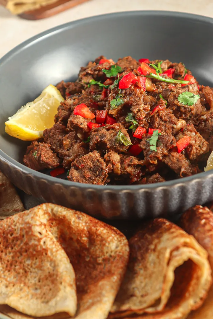 Kismayo Kitchen signature dishes Suqaar (Somali-style stir-fried meat), Kismayo Chicken Wrap